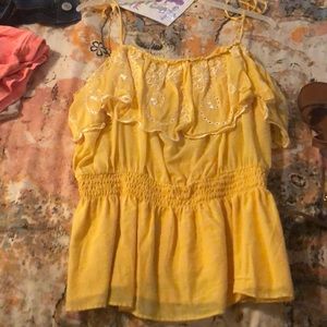 A bright yellow Top